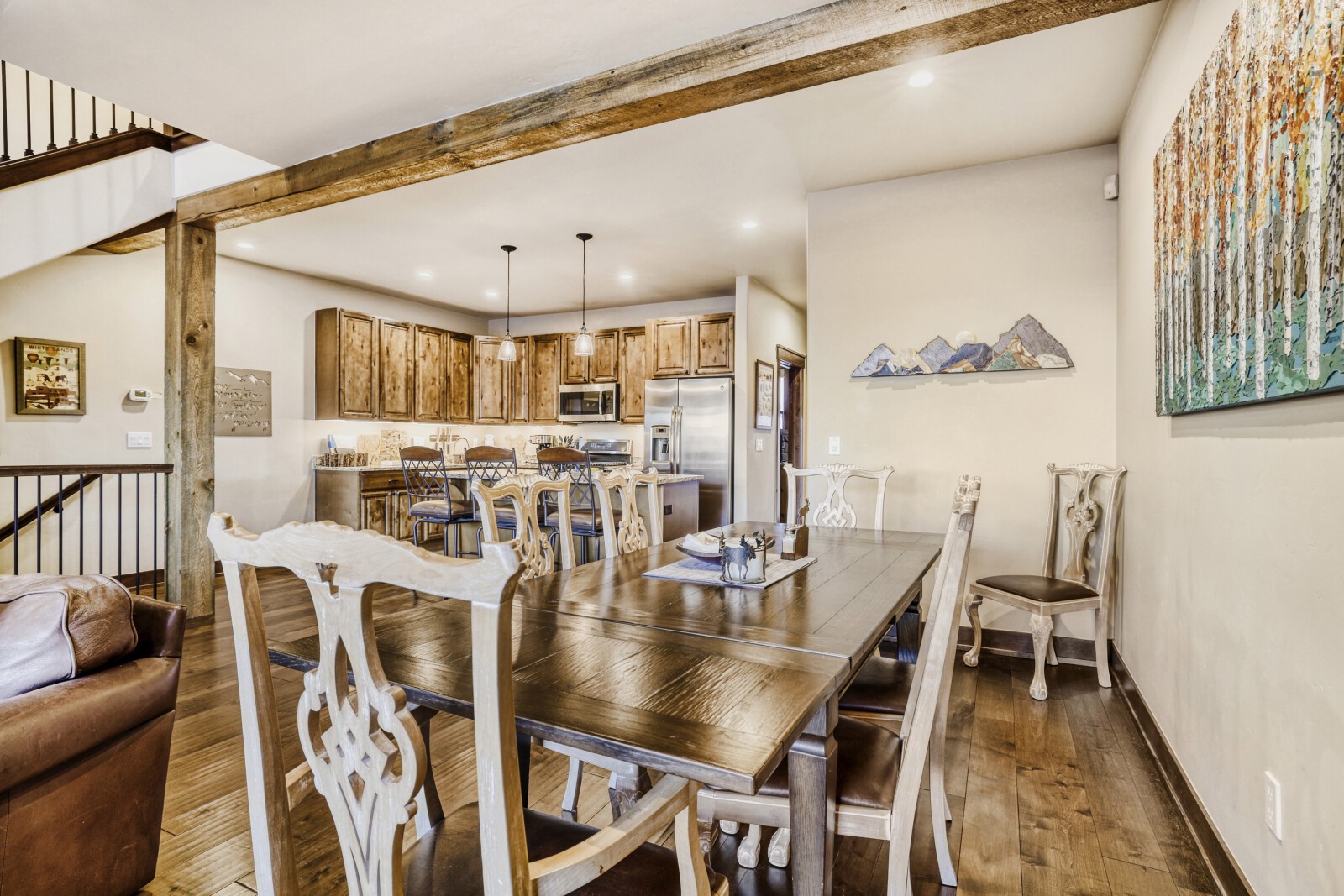 852 Independence Road, Unit B Keystone, CO 80435 - Photo 15 of 38 a view of a dining room with furniture and wooden floor