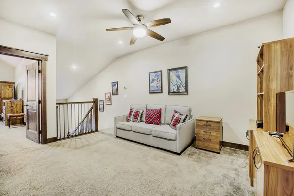 a bedroom with a bed and a television