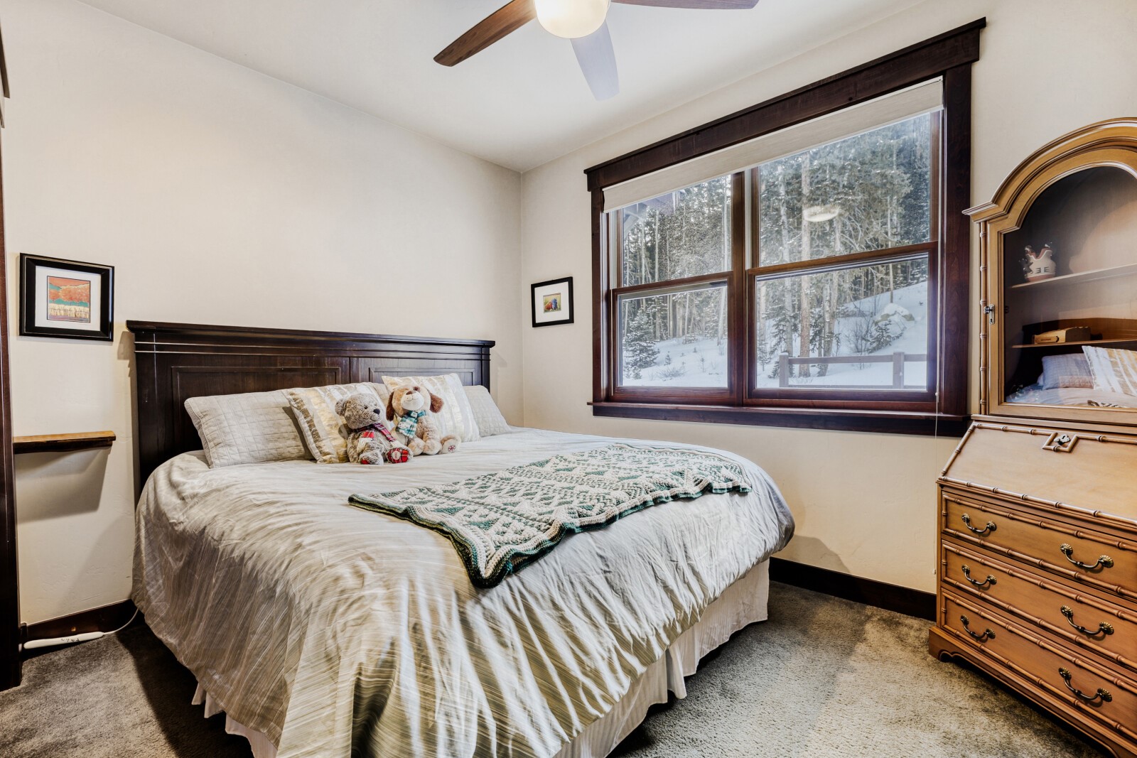 852 Independence Road, Unit B Keystone, CO 80435 - Photo 22 of 38 a bedroom with a bed and a dresser next to a window