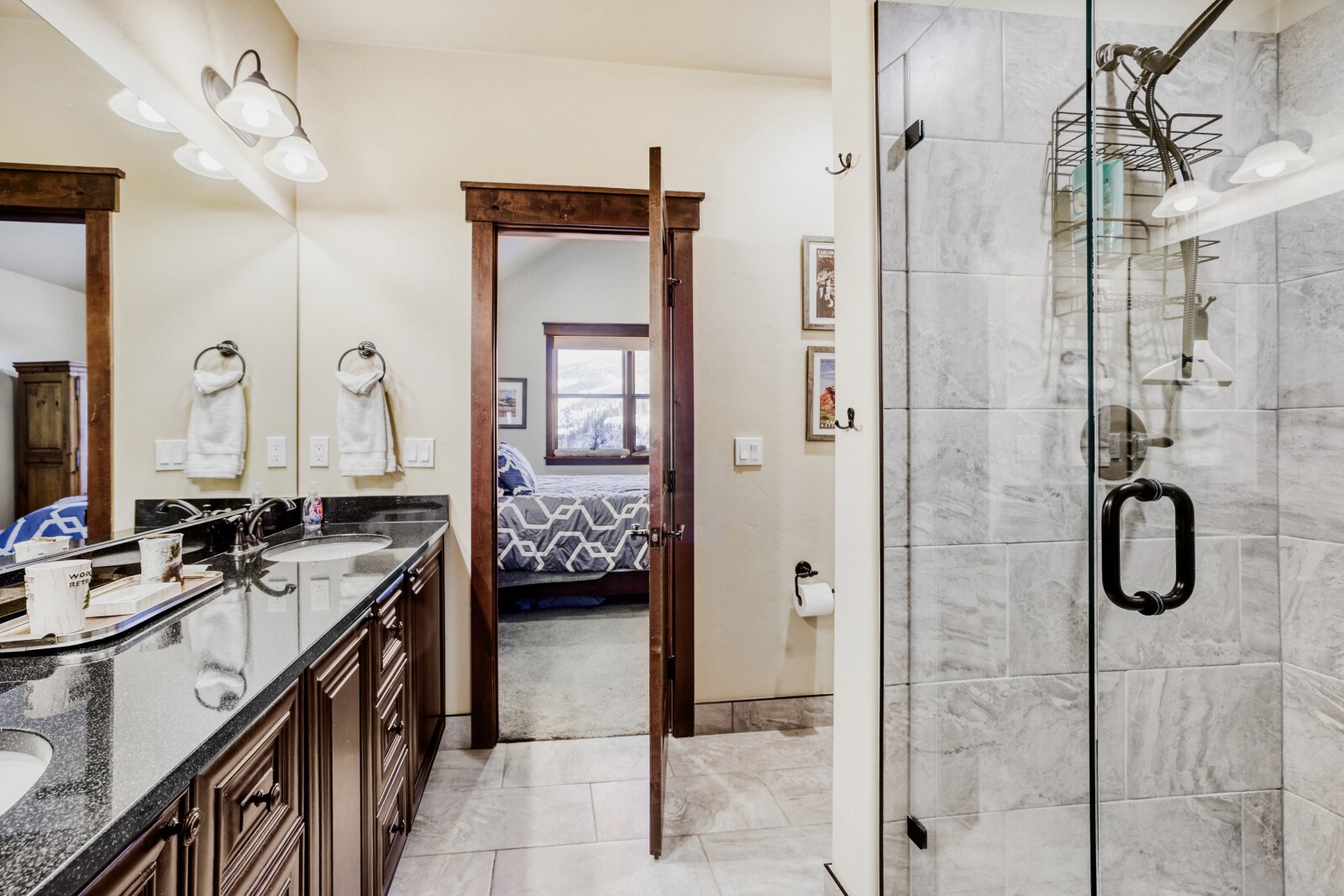 852 Independence Road, Unit B Keystone, CO 80435 - Photo 24 of 38 a en suite bathroom with a shower sink and mirror