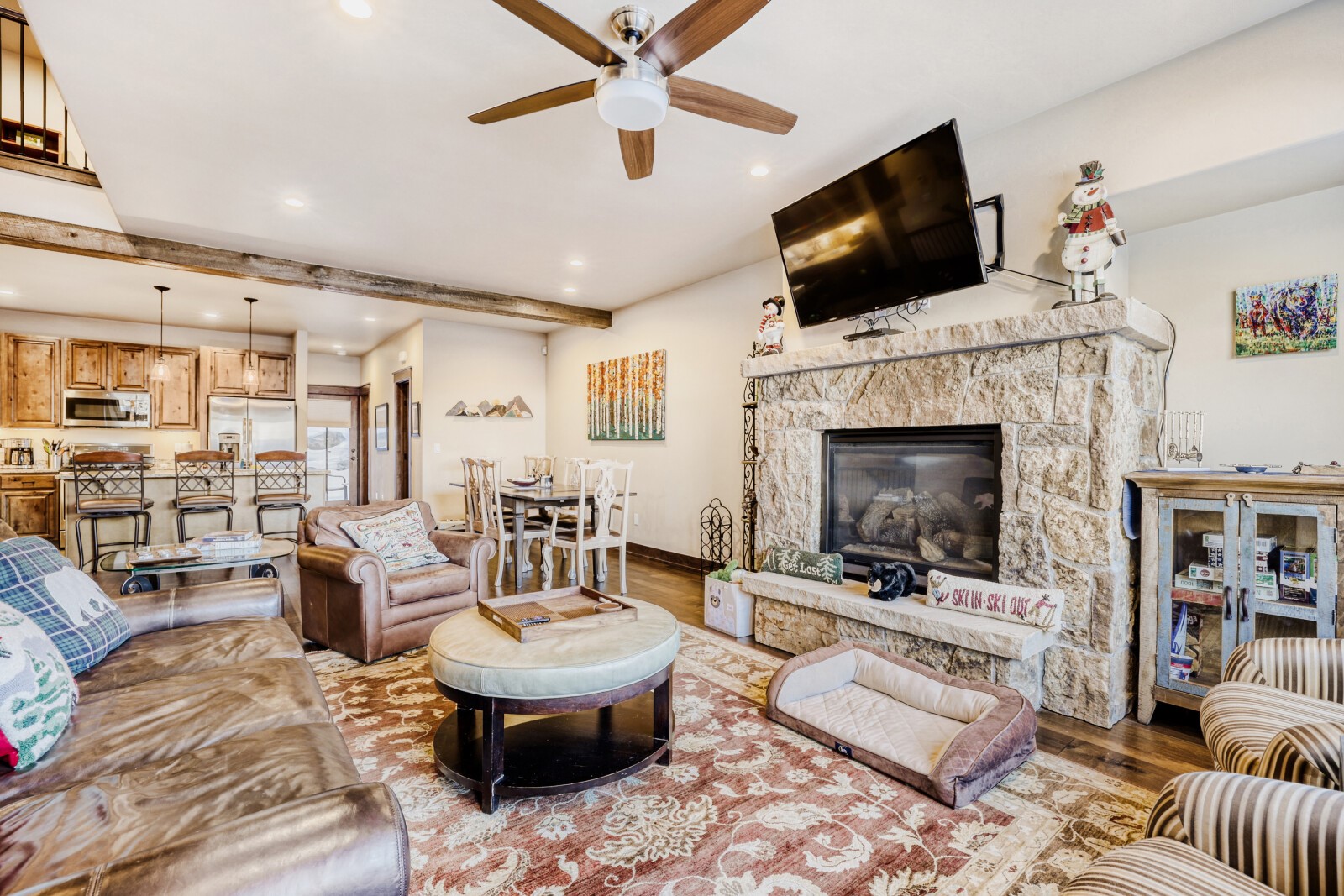 852 Independence Road, Unit B Keystone, CO 80435 - Photo 4 of 38 a living room with furniture a flat screen tv and a fireplace