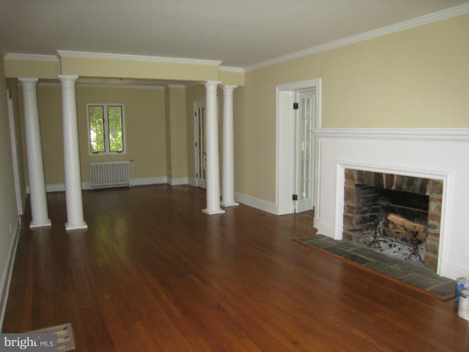 907 Old Oak Road Baltimore, MD 21212 - Photo 1 of 28 a view of a livingroom with wooden floor a fireplace and window