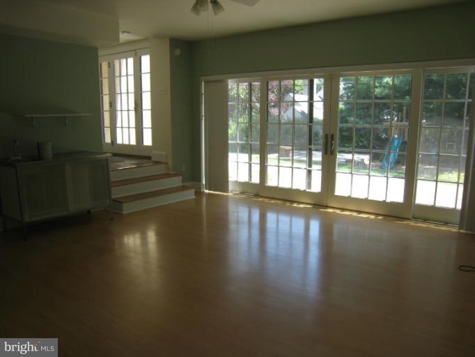 907 Old Oak Road Baltimore, MD 21212 - Photo 2 of 28 a view of empty room with wooden floor and fan