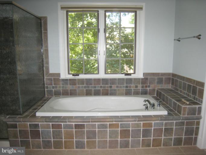 907 Old Oak Road Baltimore, MD 21212 - Photo 24 of 28 a bath tub sitting next to a window