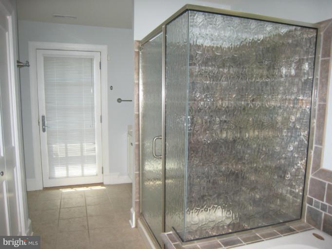 907 Old Oak Road Baltimore, MD 21212 - Photo 7 of 28 a bathroom with a glass shower door