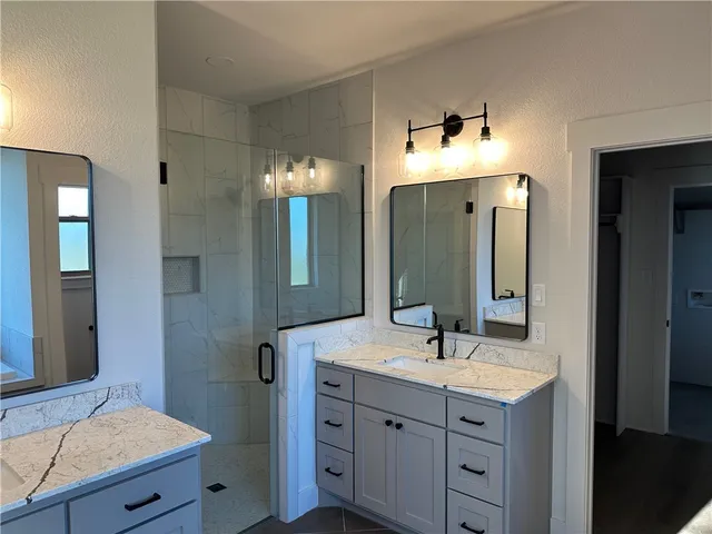 a bathroom with a bathtub and next to a window