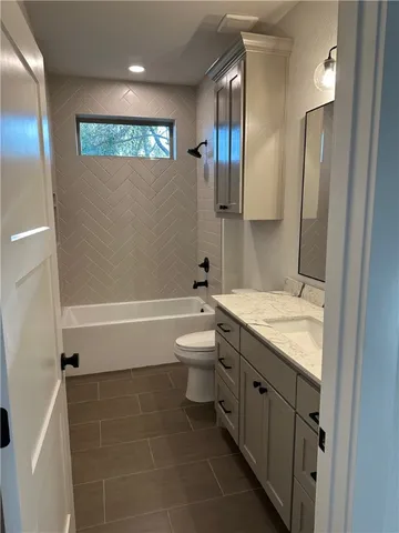 a view of a backyard with table and chairs and garden