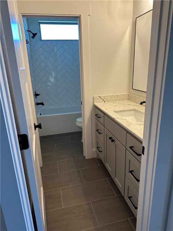 10474 Whiskey River Road Bryan, TX 77808 - Photo 17 of 37 a bathroom with a granite countertop sink and a mirror