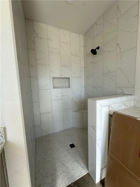 10474 Whiskey River Road Bryan, TX 77808 - Photo 27 of 37 a bathroom with a shower