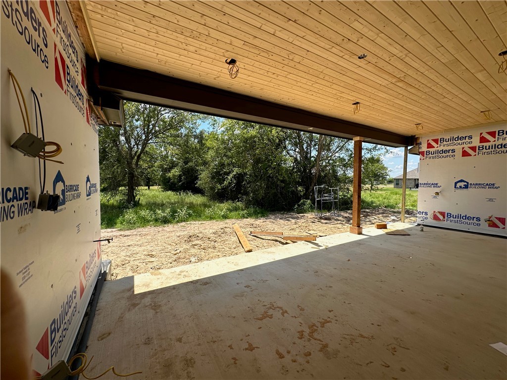 10474 Whiskey River Road Bryan, TX 77808 - Photo 32 of 37 a view of a backyard of a house