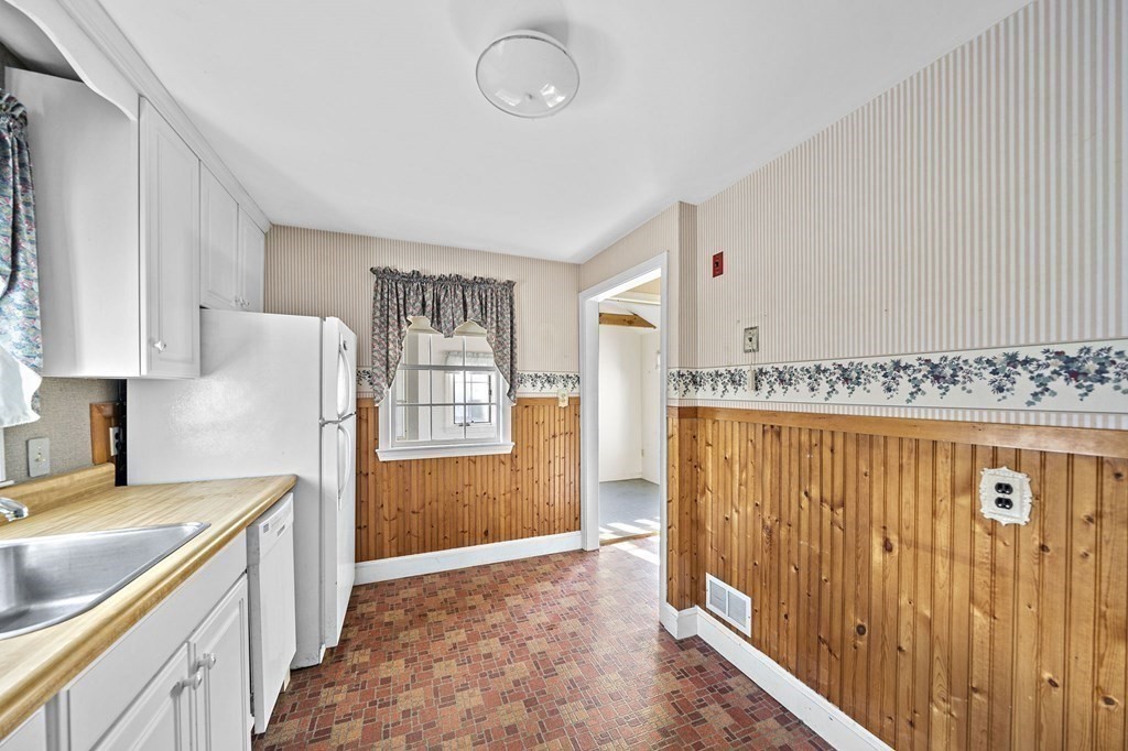 49 Rinaldo Road Weymouth, MA 02191 - Photo 6 of 24 a view of kitchen with stainless steel appliances granite countertop cabinets and wooden floor