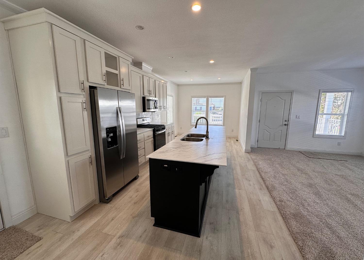 20 Commodore Lane Sacramento, CA 95838 - Photo 2 of 4 a kitchen with stainless steel appliances a refrigerator and a sink