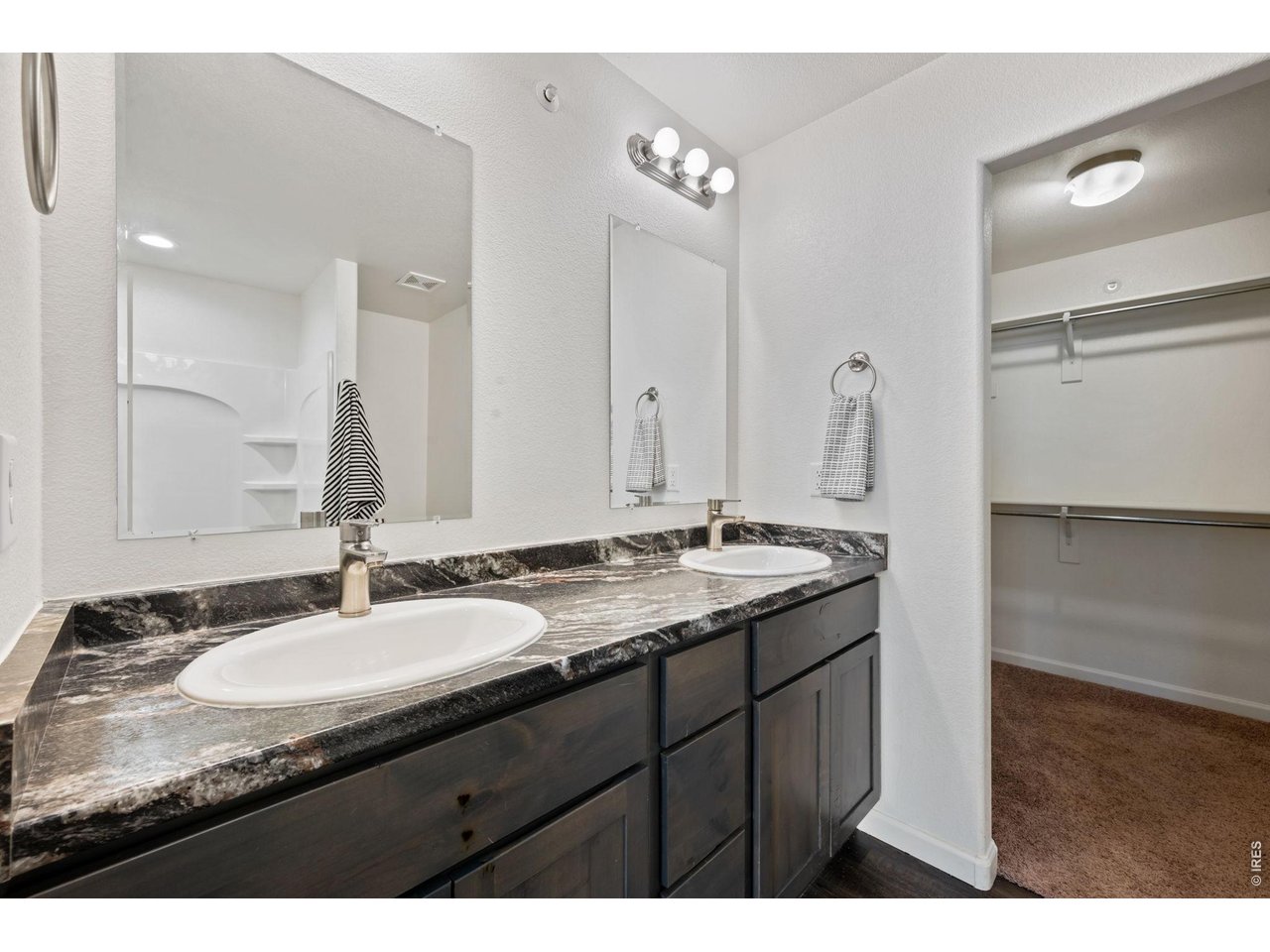4355 24th Street Road, Unit 803 Greeley, CO 80634 - Photo 11 of 17 Primary Bathroom with double sinks; Walk-in Closet