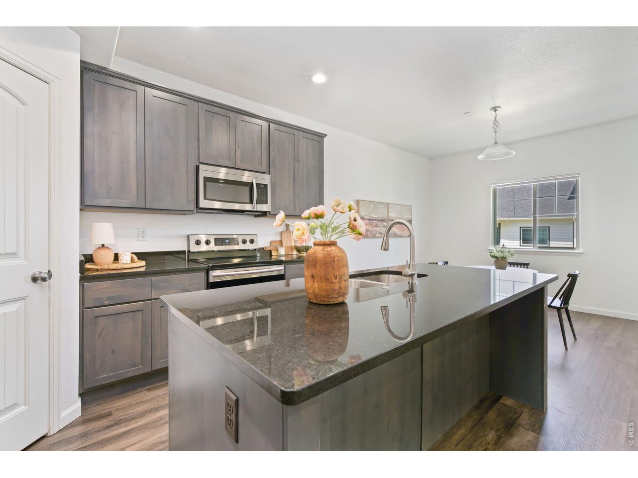 4355 24th Street Road, Unit 803 Greeley, CO 80634 - Photo 3 of 17 Island Kitchen with Bar Seating
