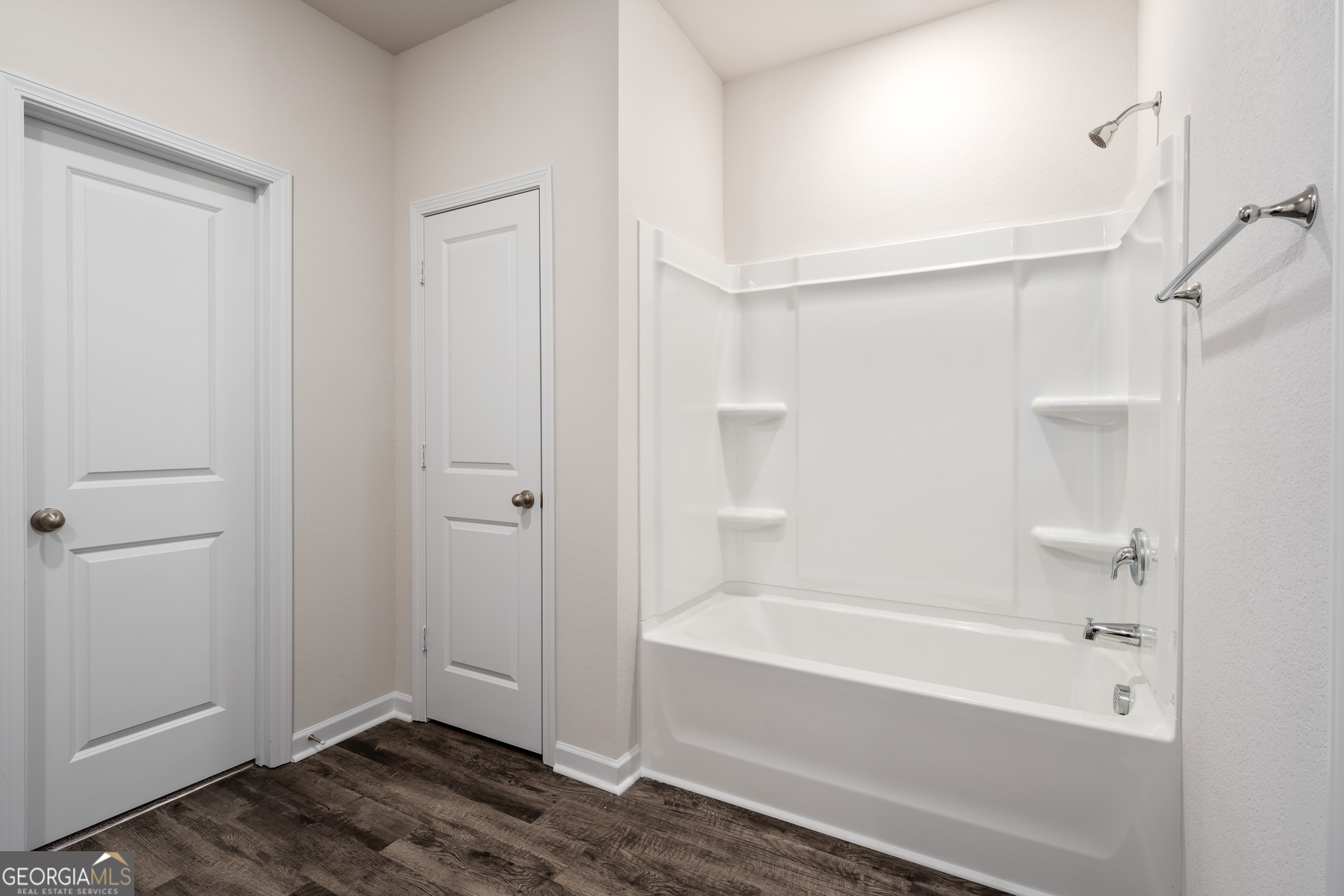 115 Darter Court Jefferson, GA 30549 - Photo 11 of 16 a bathroom with a bathtub and a shower