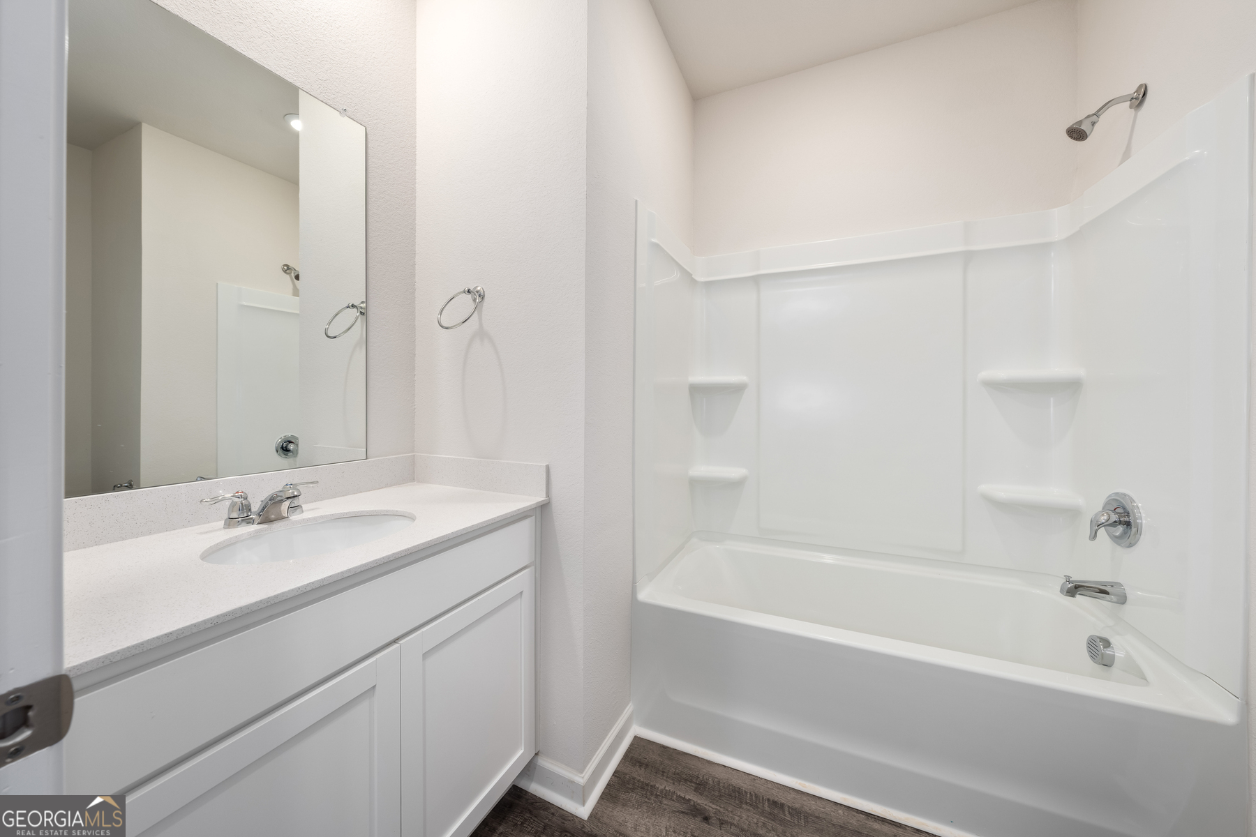 115 Darter Court Jefferson, GA 30549 - Photo 12 of 16 a bathroom with a tub sink shower and a mirror