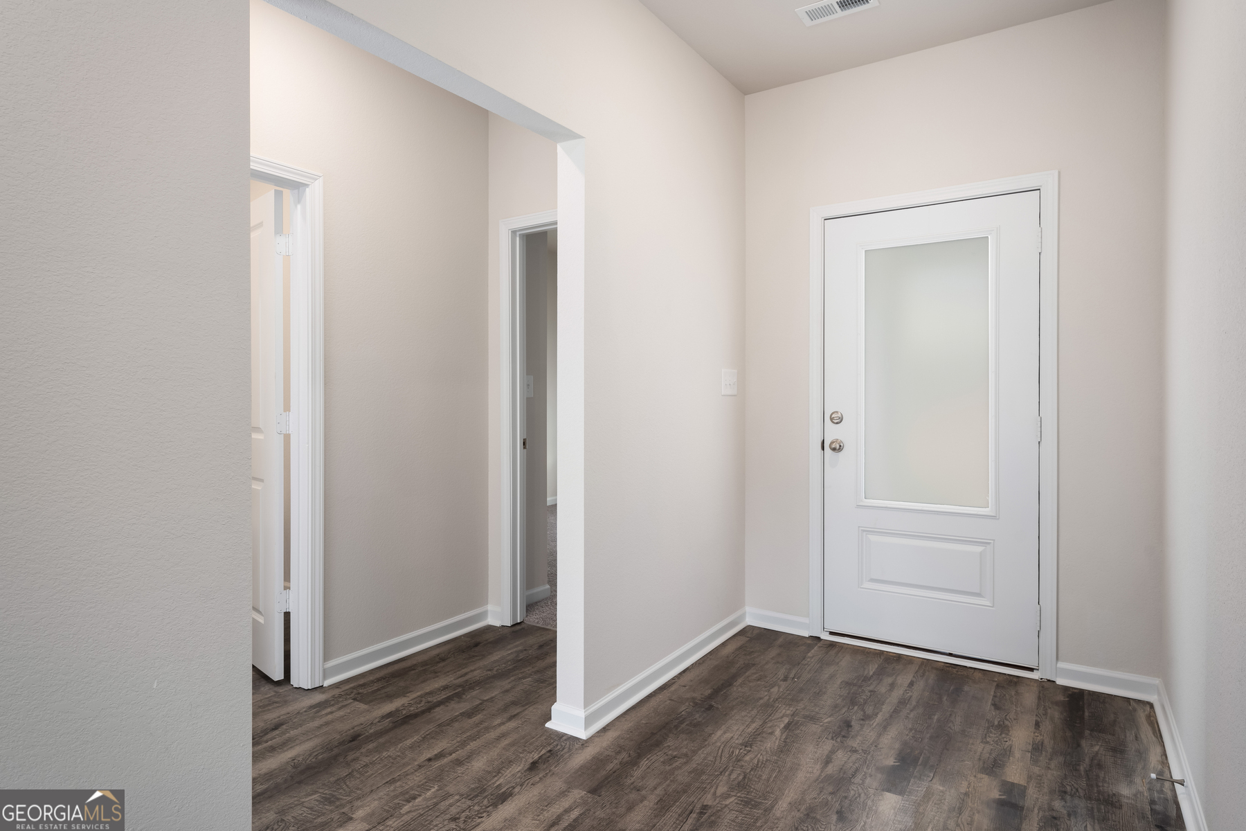 115 Darter Court Jefferson, GA 30549 - Photo 4 of 16 a view of an empty room with closet and wooden floor