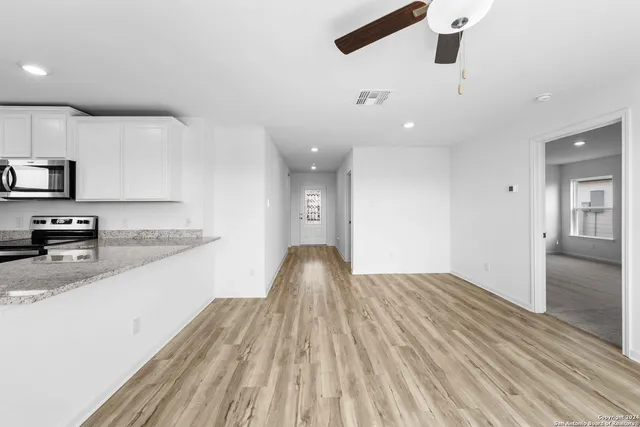 a view of a kitchen with a sink and dishwasher
