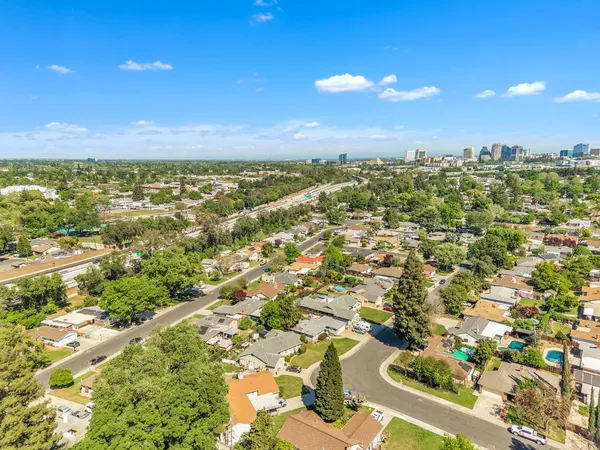 an aerial view of residential houses with outdoor space