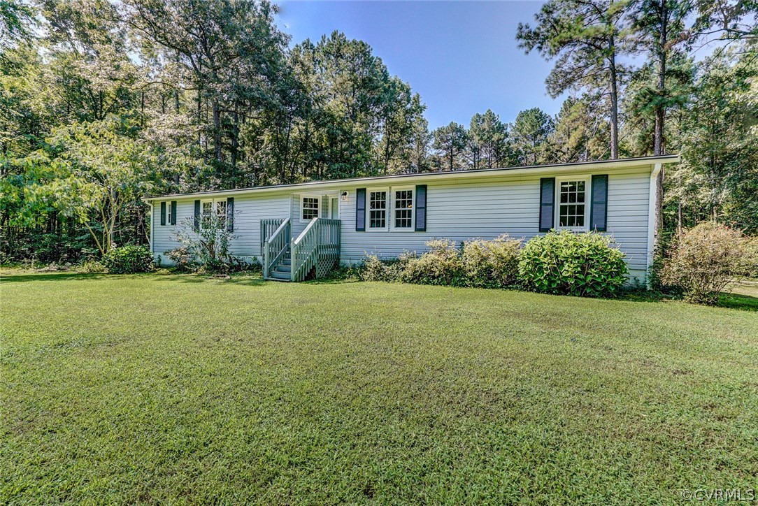 17684 Baltimore Road Dewitt, VA 23840 - Photo 2 of 42 front view of house with yard and trees all around