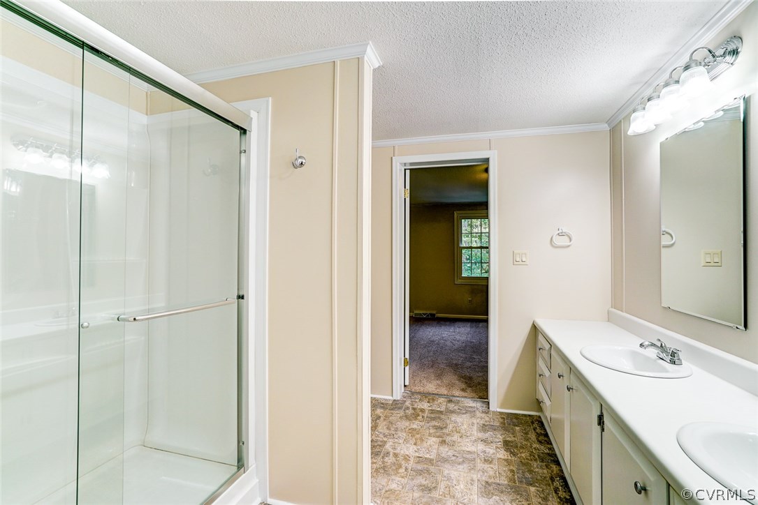 17684 Baltimore Road Dewitt, VA 23840 - Photo 21 of 42 a bathroom with a double vanity sink and mirror