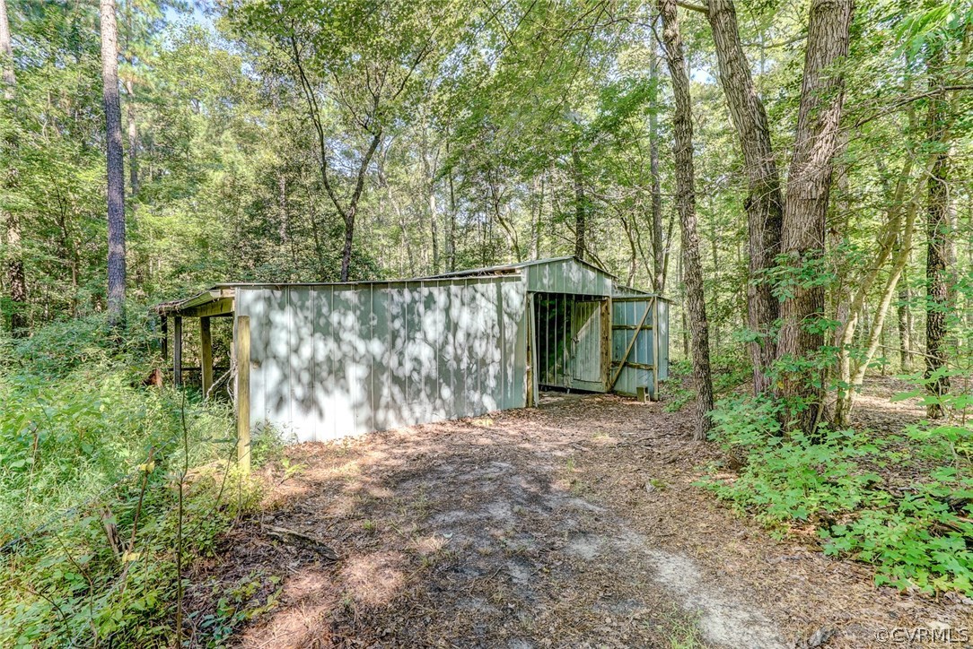 17684 Baltimore Road Dewitt, VA 23840 - Photo 31 of 42 a view of a yard with large trees