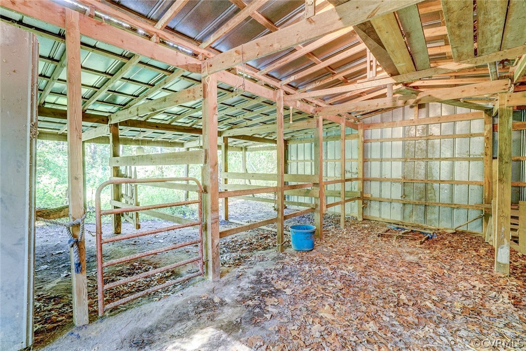 17684 Baltimore Road Dewitt, VA 23840 - Photo 33 of 42 a view of empty room with wooden floor and floor to ceiling windows