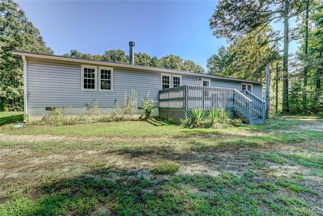 17684 Baltimore Road Dewitt, VA 23840 - Photo 4 of 42 a view of a house with a yard