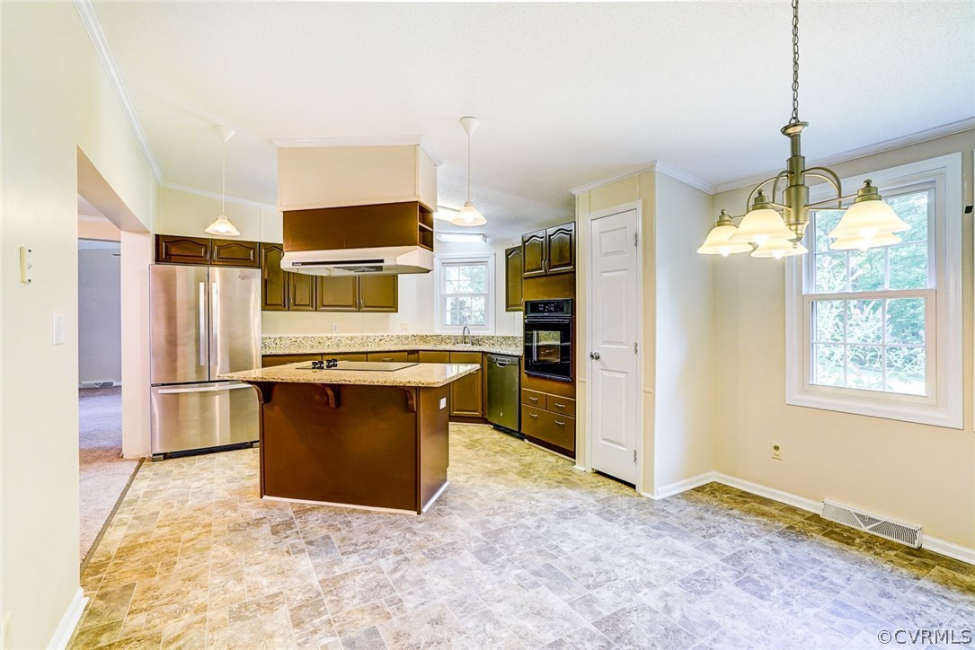 17684 Baltimore Road Dewitt, VA 23840 - Photo 10 of 42 a kitchen with stainless steel appliances granite countertop a refrigerator and a stove
