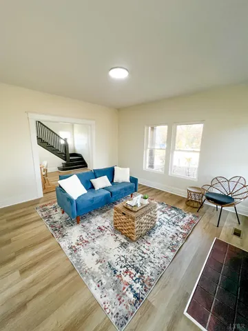 a bedroom with two beds and painting on the wall