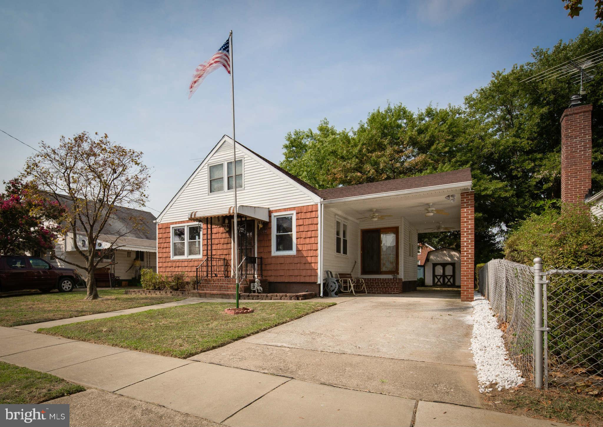 2604 Lynbrook Road Baltimore, MD 21222 - Photo 2 of 30 a front view of a house with a yard
