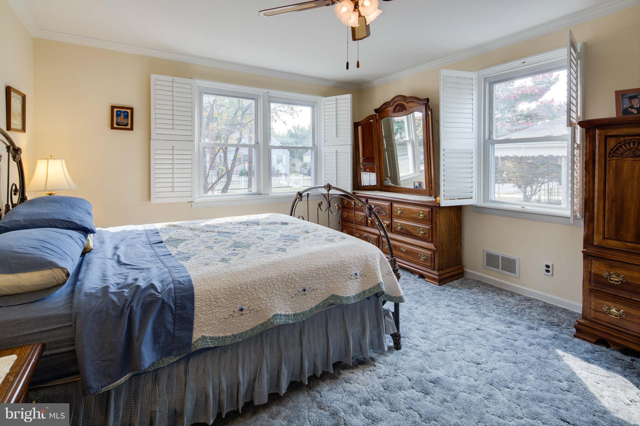 2604 Lynbrook Road Baltimore, MD 21222 - Photo 15 of 30 a bedroom with a bed window and a television
