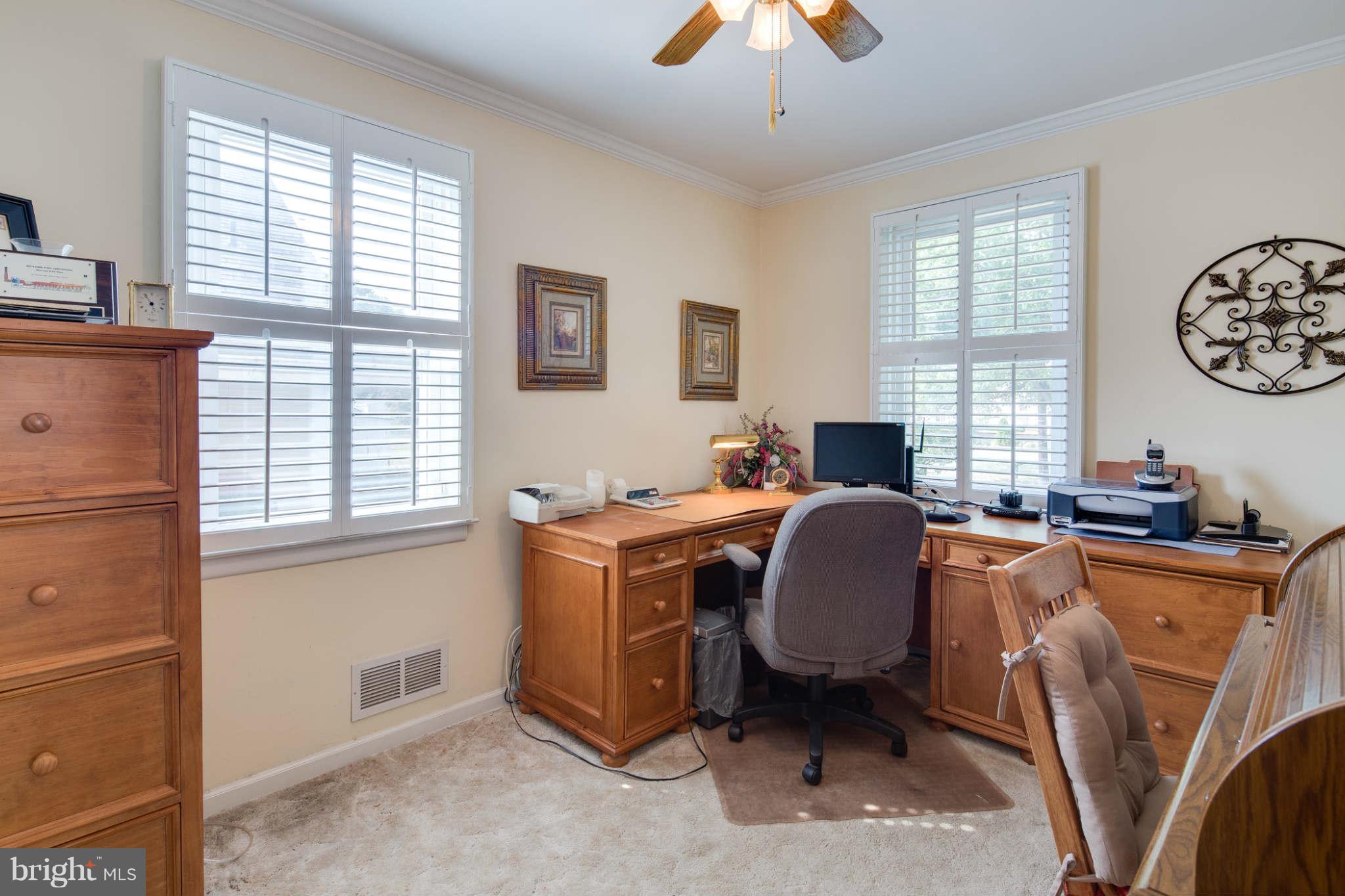 2604 Lynbrook Road Baltimore, MD 21222 - Photo 16 of 30 a view of a workspace with furniture and a window
