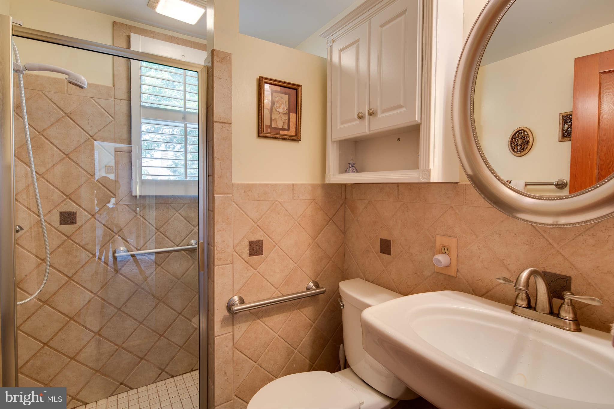 2604 Lynbrook Road Baltimore, MD 21222 - Photo 17 of 30 a bathroom with a sink and a mirror
