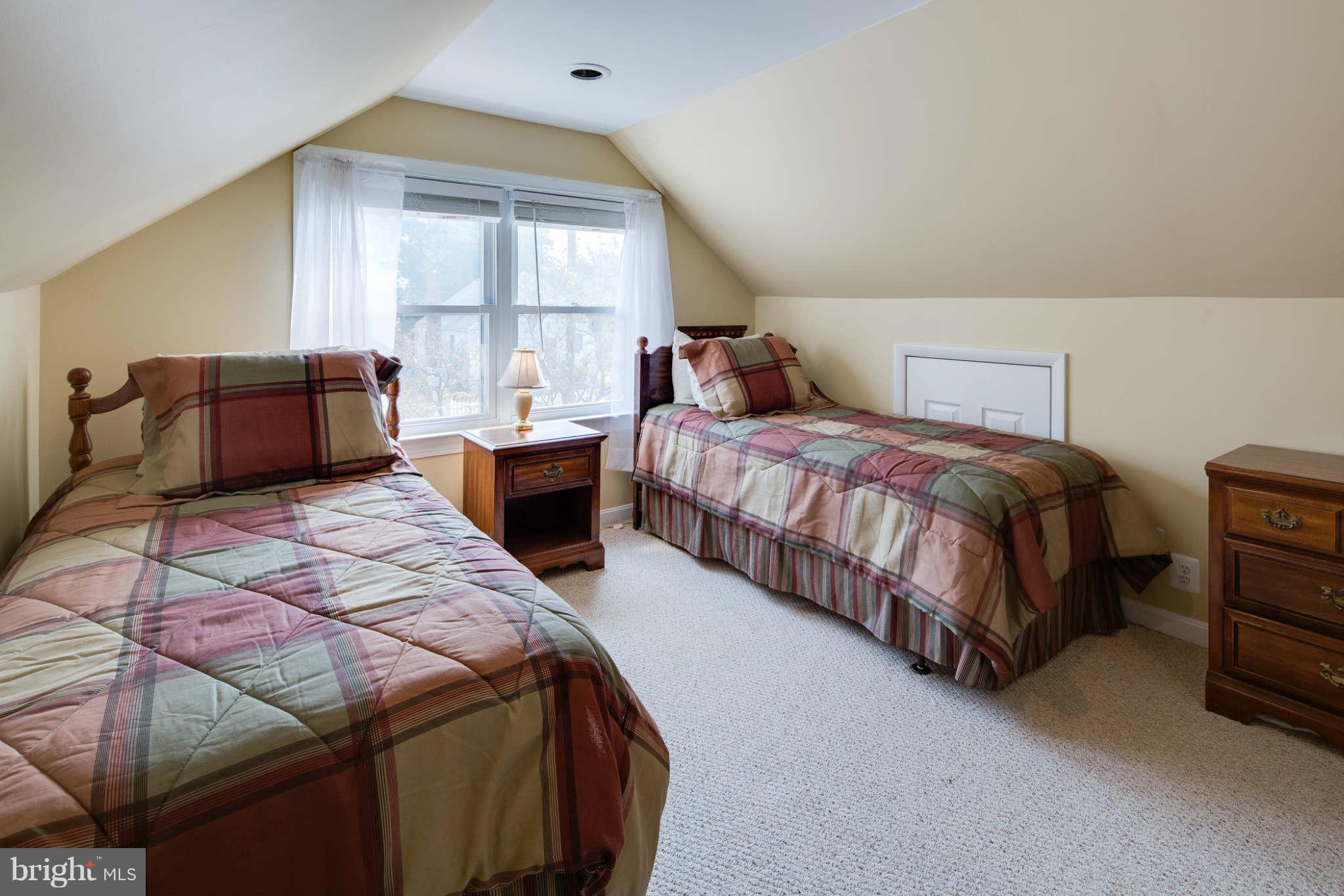 2604 Lynbrook Road Baltimore, MD 21222 - Photo 21 of 30 a bedroom with two beds and a large window