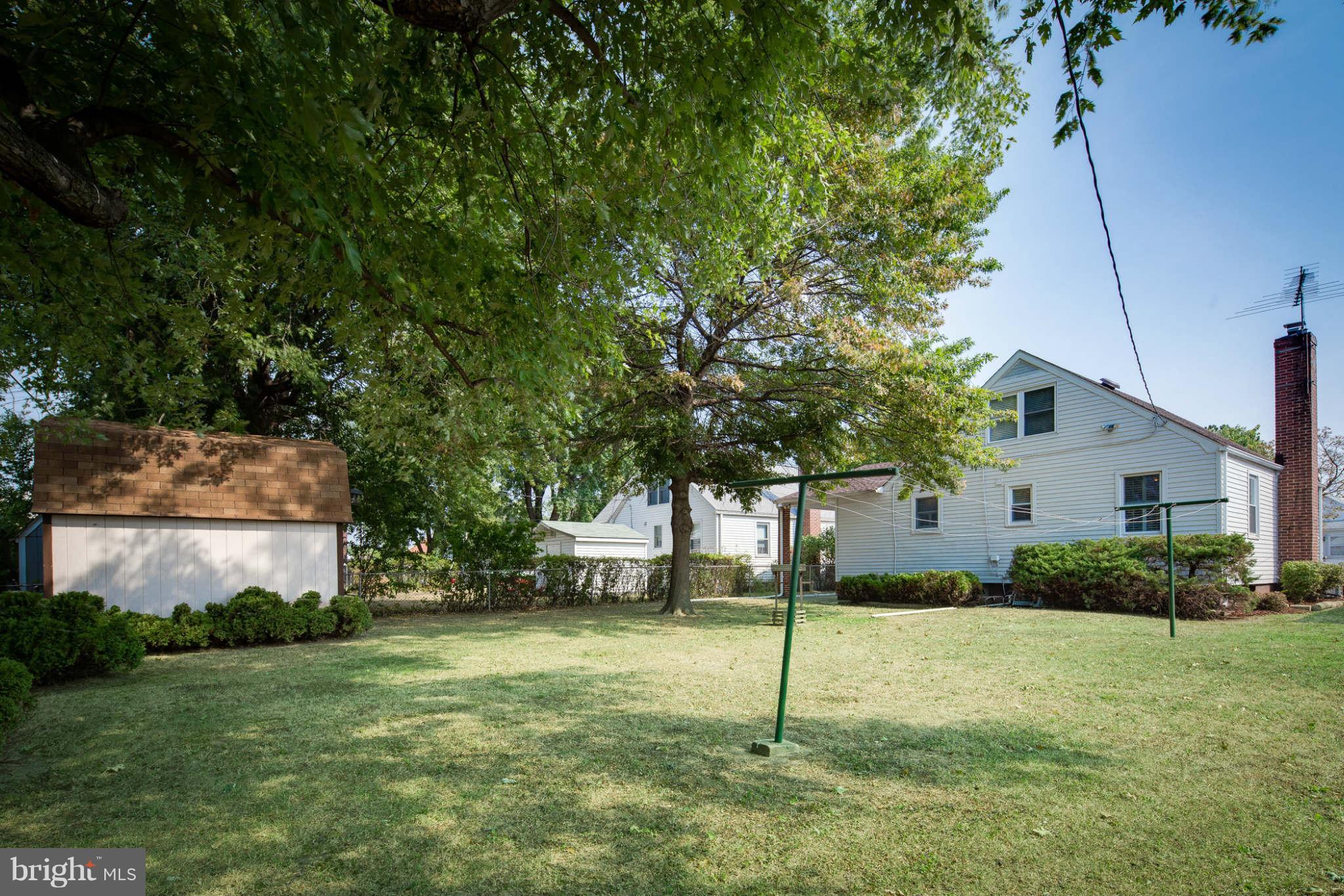2604 Lynbrook Road Baltimore, MD 21222 - Photo 24 of 30 a backyard of a house with lots of green space