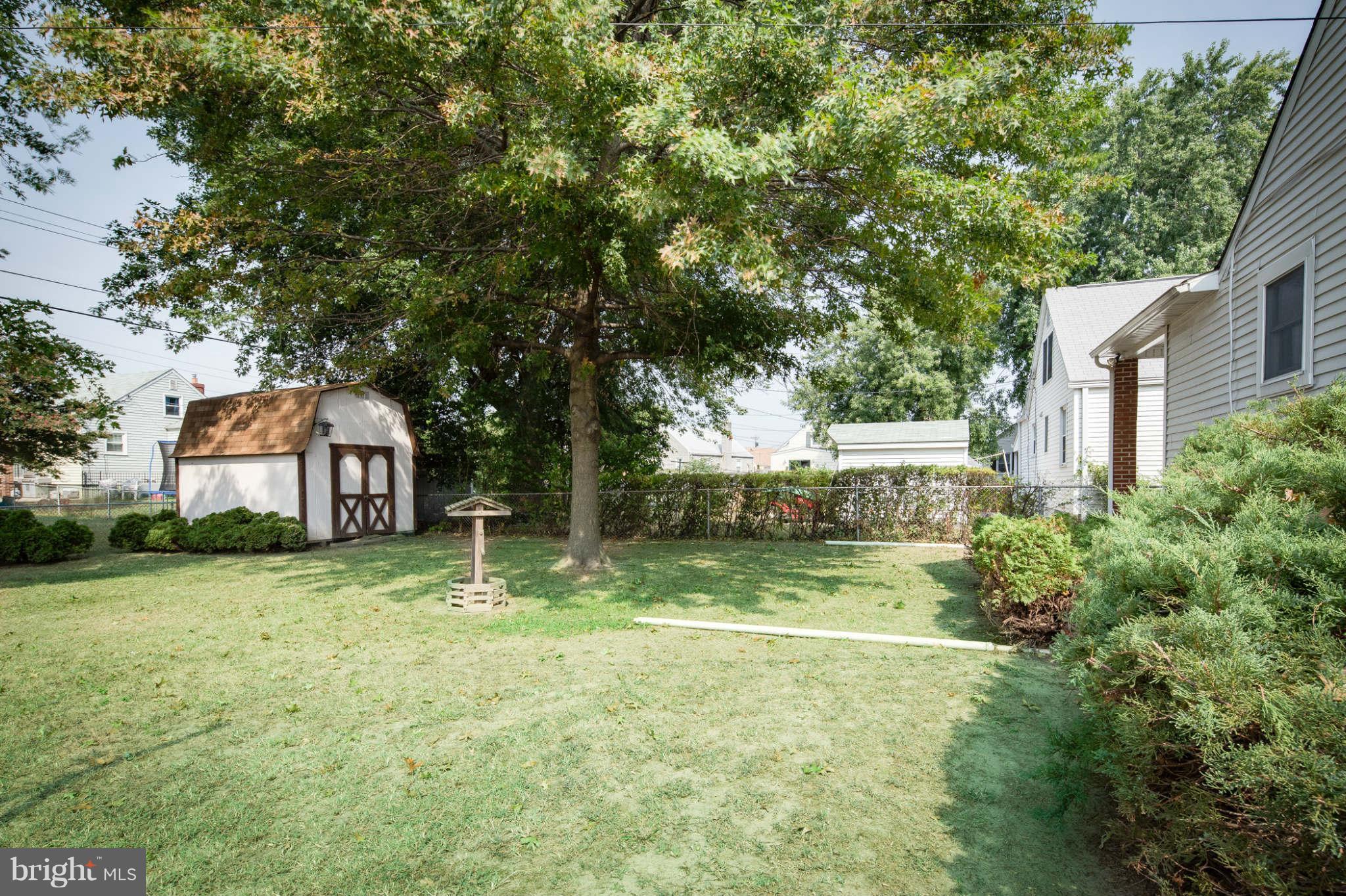 2604 Lynbrook Road Baltimore, MD 21222 - Photo 25 of 30 a view of a house with a yard