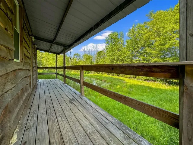 a view of balcony with wooden floor