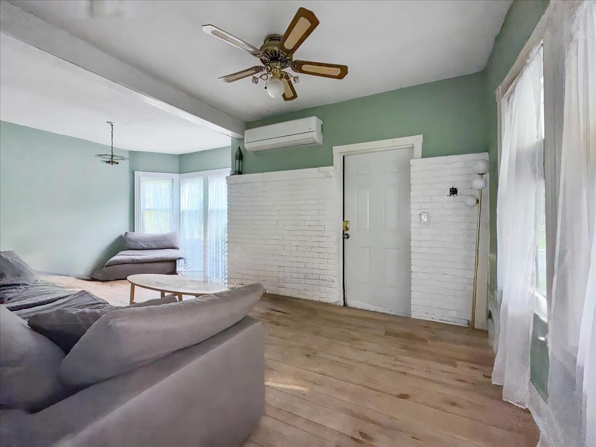 30 Station Hill Road Ferndale, NY 12734 - Photo 9 of 27 a bedroom with a bed and a chandelier