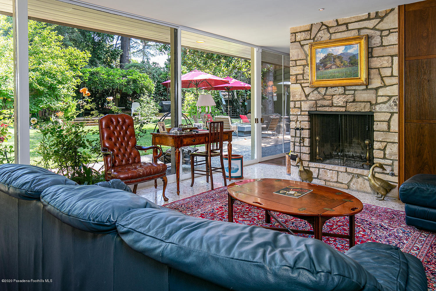 600 Busch Place Pasadena, CA 91105 - Photo 2 of 47 a living room with furniture a fireplace and a floor to ceiling window