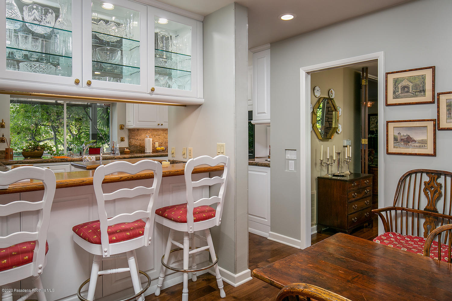 600 Busch Place Pasadena, CA 91105 - Photo 16 of 47 a dining room with furniture a rug and a floor to ceiling window