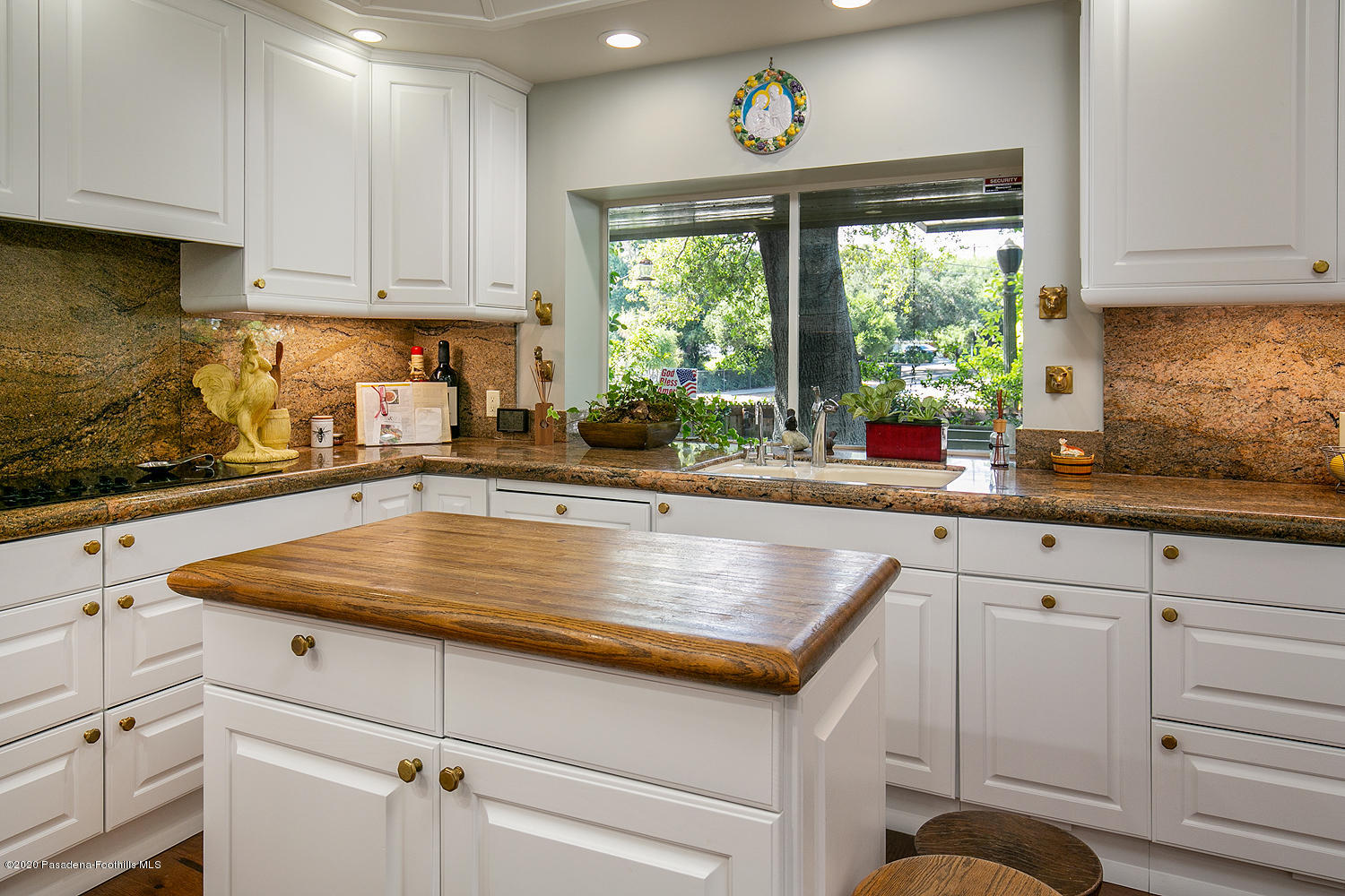 600 Busch Place Pasadena, CA 91105 - Photo 17 of 47 a kitchen with sink a window and cabinets