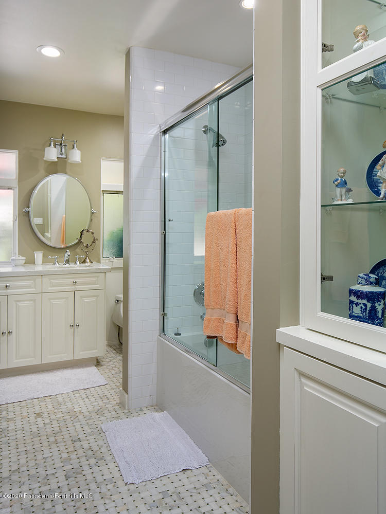 600 Busch Place Pasadena, CA 91105 - Photo 25 of 47 a bathroom with a sink a toilet and a mirror