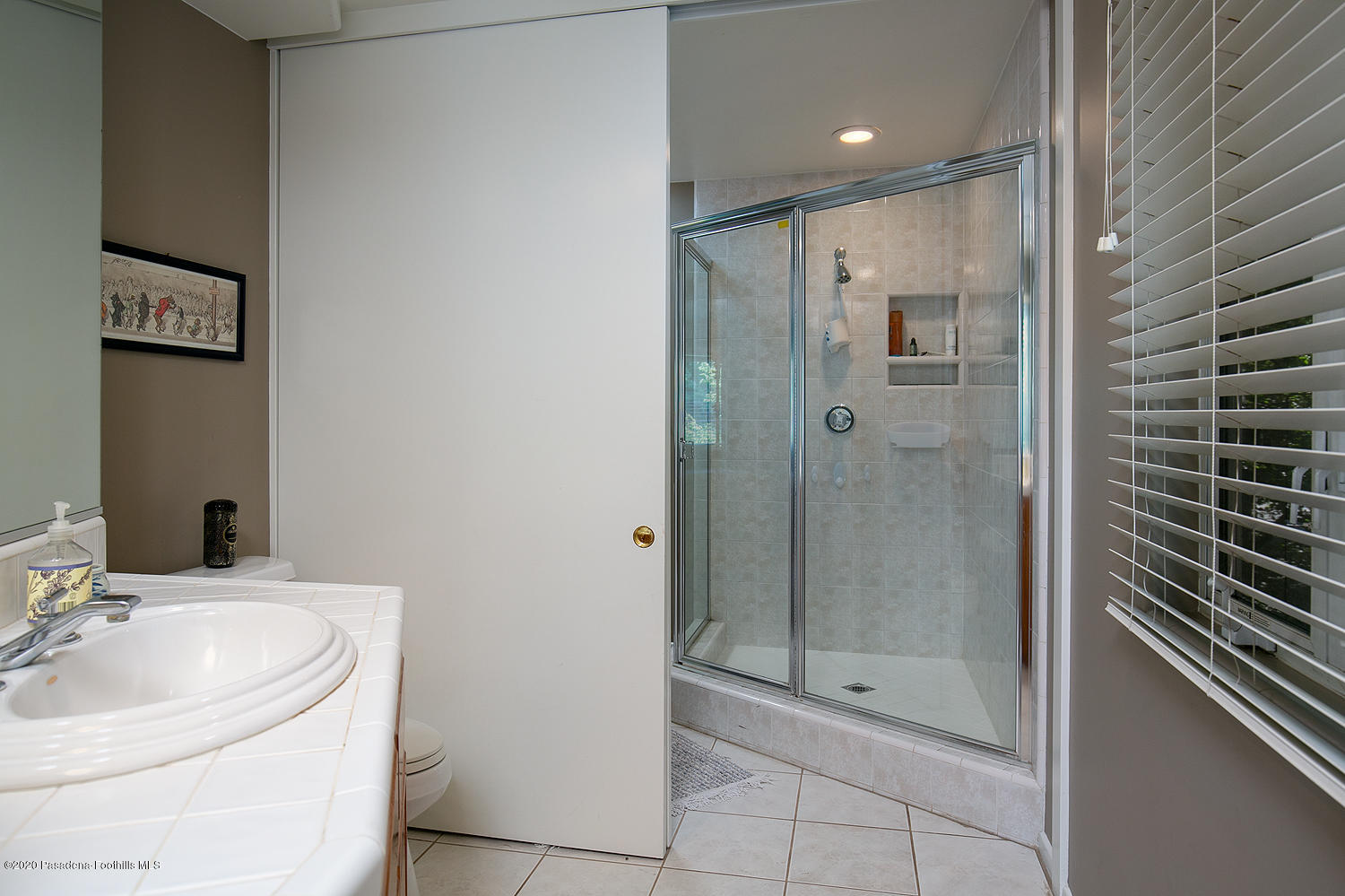 600 Busch Place Pasadena, CA 91105 - Photo 32 of 47 a bathroom with a shower and a sink