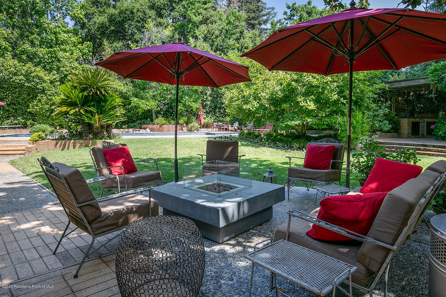 600 Busch Place Pasadena, CA 91105 - Photo 37 of 47 a view of a patio with furniture and a umbrella