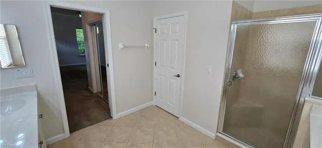 a view of a room with a ceiling fan