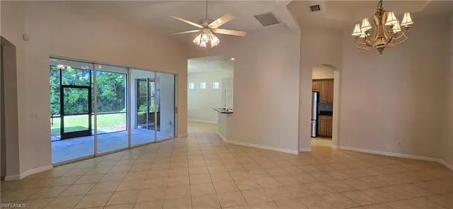 a view of a livingroom with a chandelier fan
