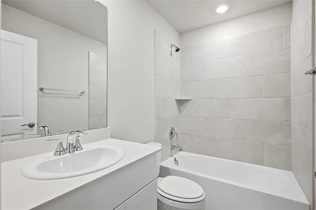 a bathroom with a toilet a sink and a bathtub