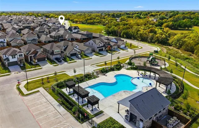 an aerial view of a house with a ocean view