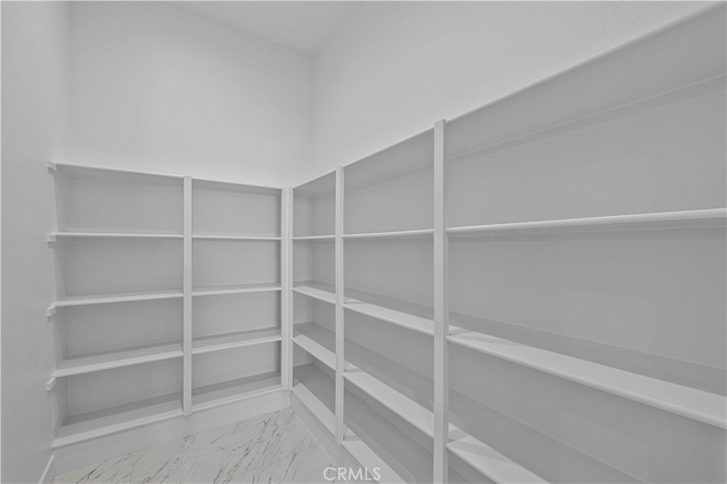 11752 Hillsborough Lane Porter Ranch, CA 91326 - Photo 15 of 45 a view of an empty walk in closet